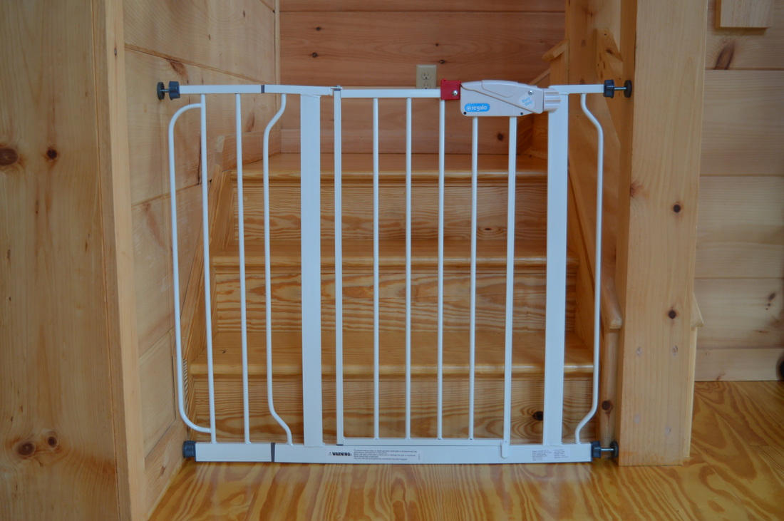 childproofing babygate at vacation rental log cabin