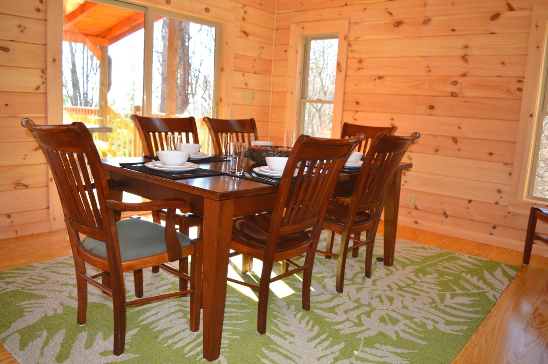 dining table for family dinners at vacation rental log cabin