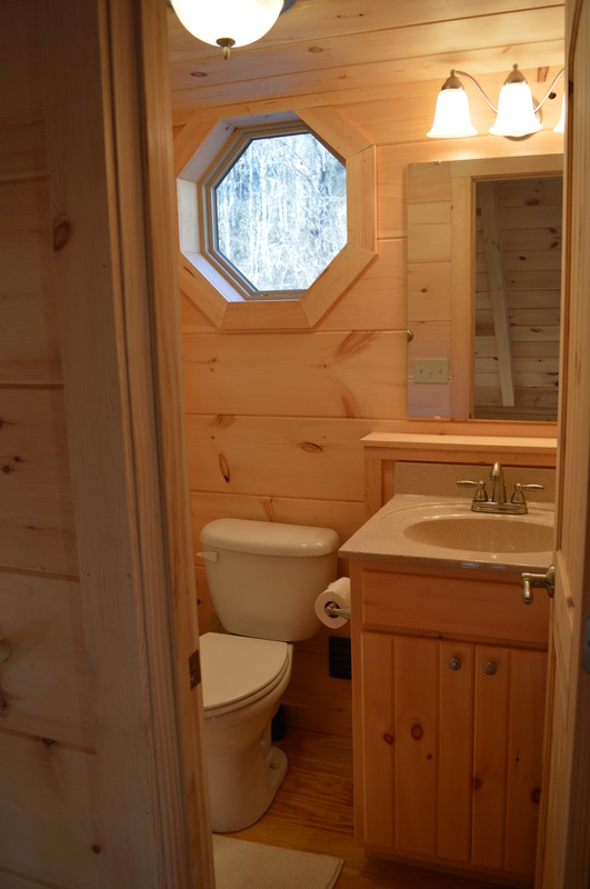 private loft bathroom at vacation rental log cabin
