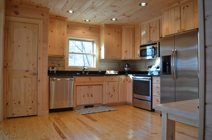large kitchen at vacation rental log cabin