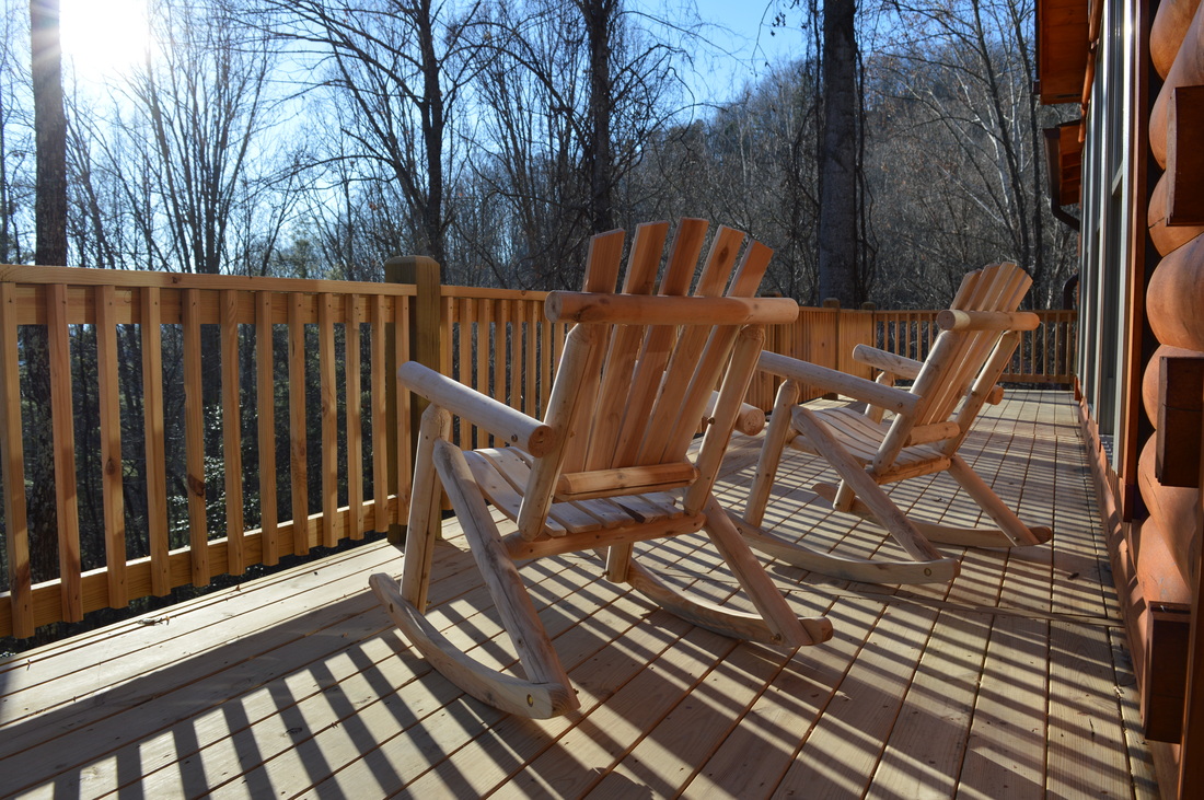 sunny deck with rocking chairs at the log cabin